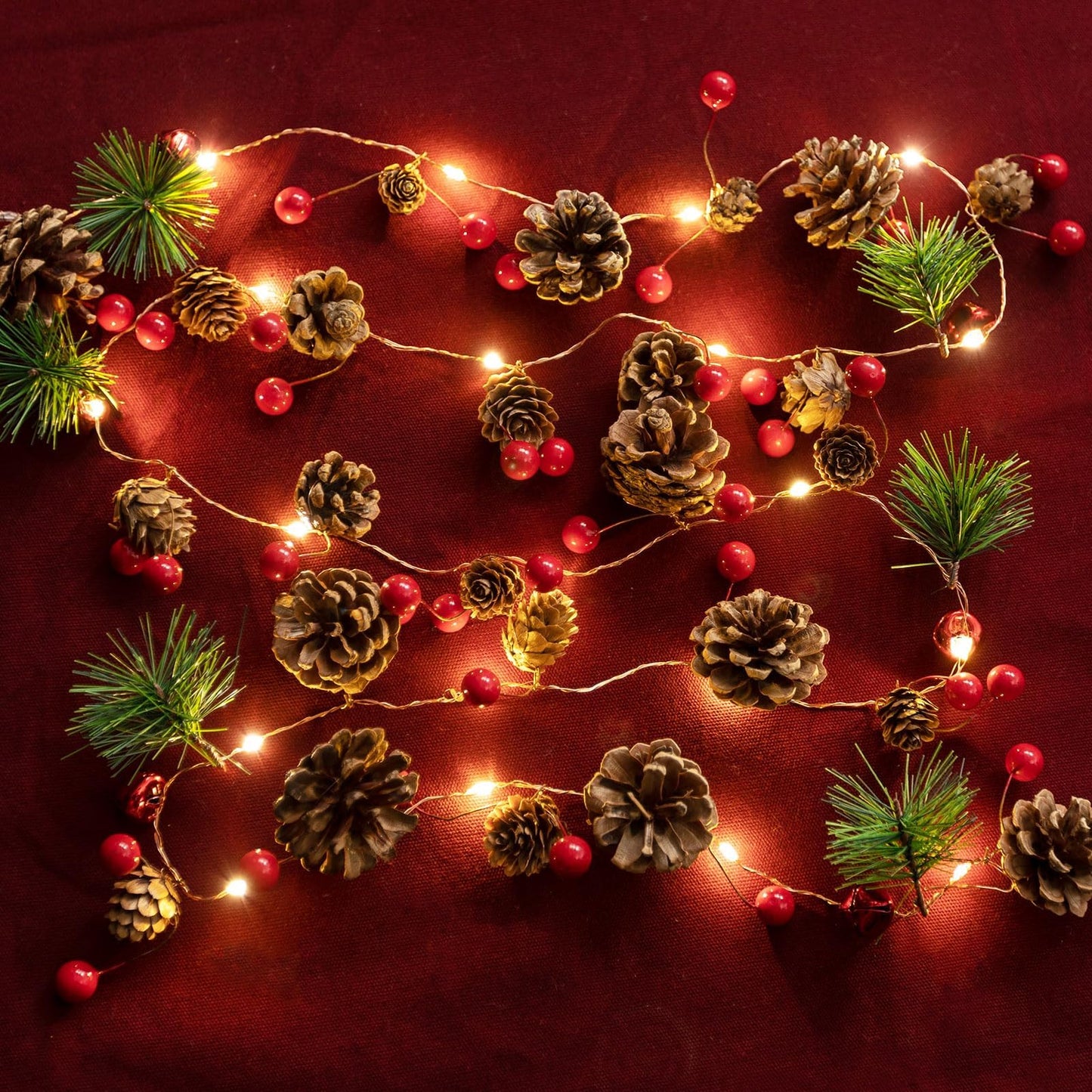 Christmas Garland with Lights, 6.6FT Pinecones Christmas String Lights with Red Berries, Bells & Needles, 20 LED Battery Operated Prelit Garland for Christmas Decorations Indoor/Outdoor (Warm White)