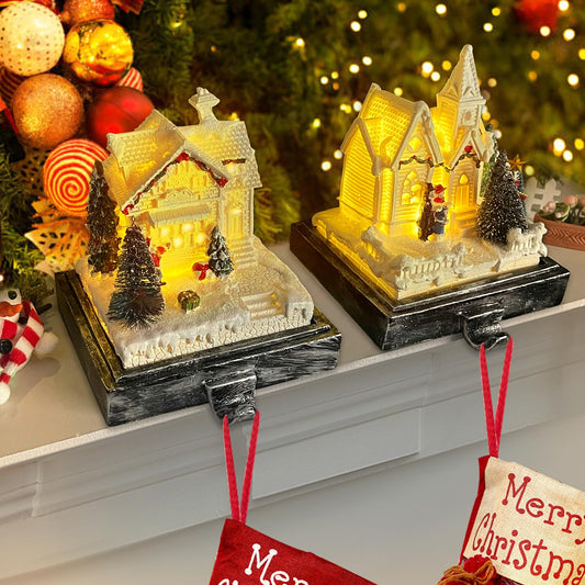 Kalolary Christmas Stocking Holders for Mantle,Set of 2 Christmas Village House Stocking Hangers with LED Lights Weighted Christmas Resin House Stocking Hooks for Fireplace Counter Window Party Decors