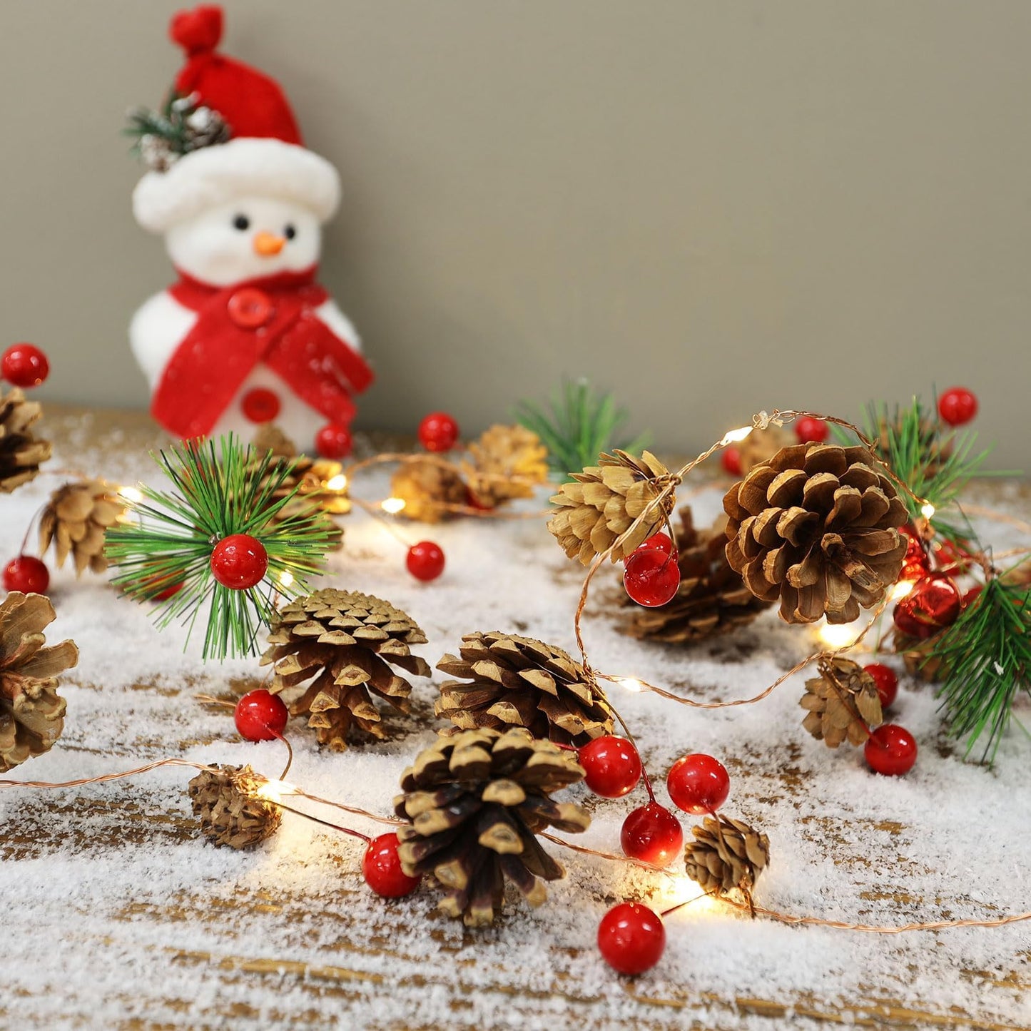 Christmas Garland with Lights, 6.6FT Pinecones Christmas String Lights with Red Berries, Bells & Needles, 20 LED Battery Operated Prelit Garland for Christmas Decorations Indoor/Outdoor (Warm White)