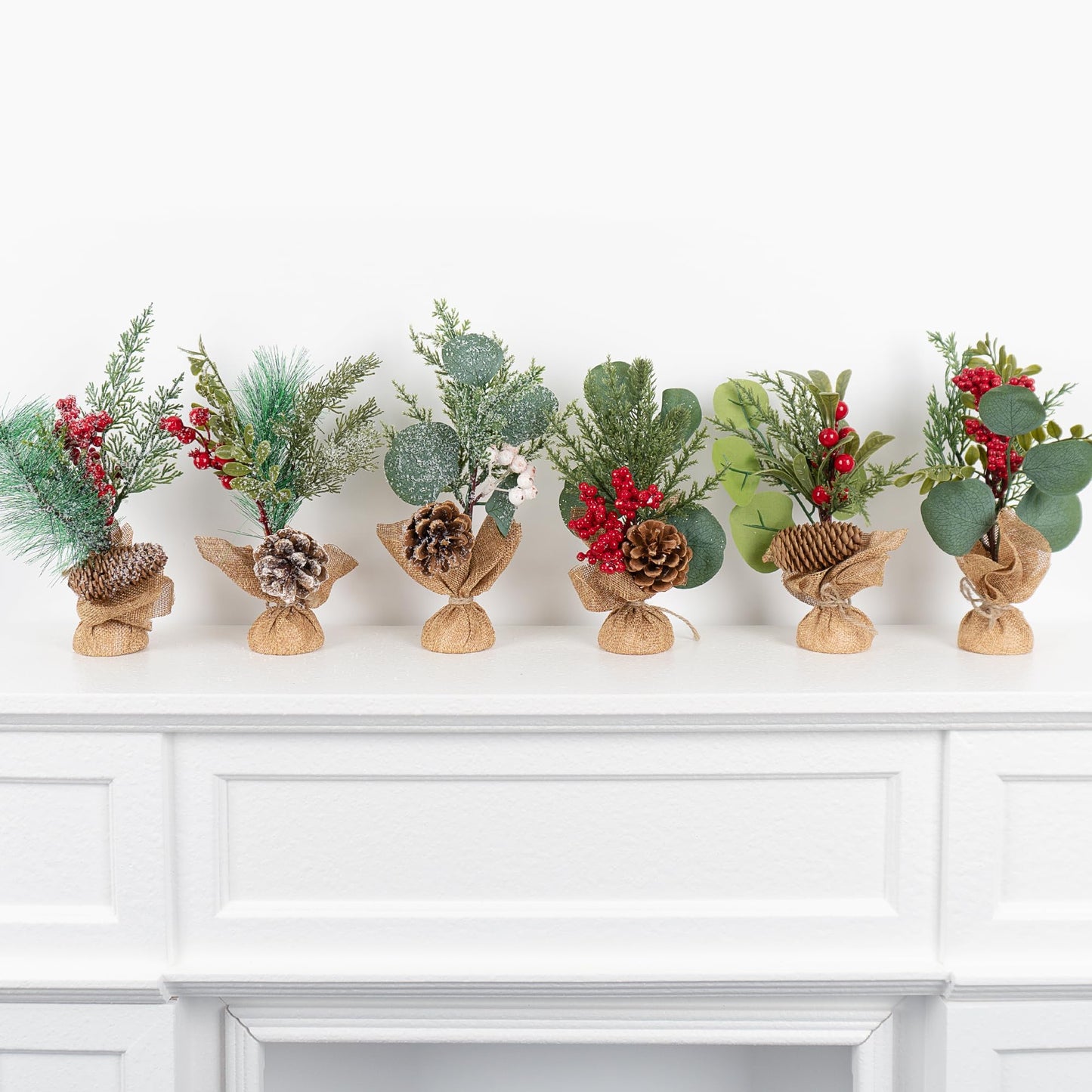 MINDELF 6 PCS Rustic Mini Christmas Tree Tabletop Set, Mixed Green Leaves, Red Berries and Pine Cones, 9 inch Artificial Trees with Burlap Bases, Ideal for Holiday Home Office Table Centerpiece